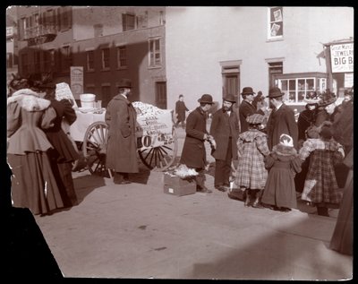 View of street vendors selling French mixed candy and other goods near 6th Avenue, New York by Byron Company
